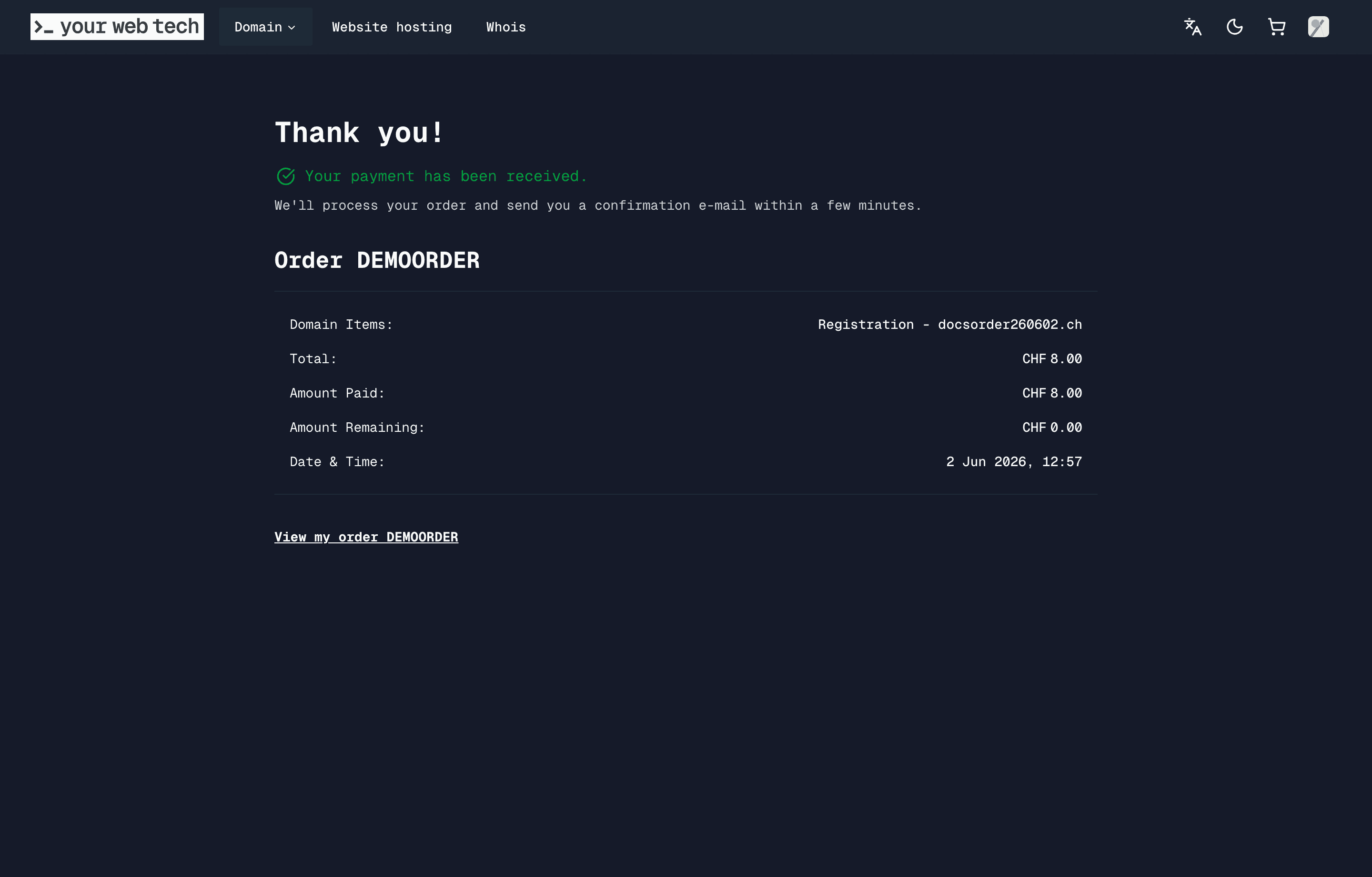 Payment confirmation page showing a paid demo order with the order ID redacted